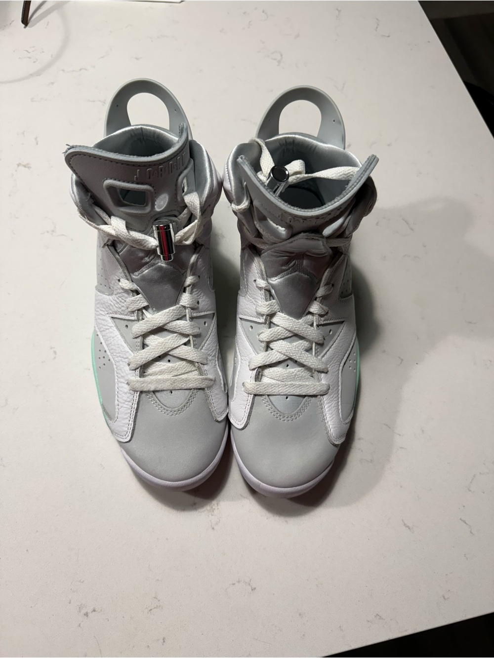 Jordan Women’s High-Top Sneakers in Light Gray and Mint